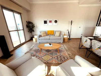 a living room with a couch and a coffee table at Skyline - Penthouse with 50m2 private terrace and stunning views in Cádiz
