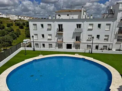 a large swimming pool in front of a building at Apartamento Esencia - Ole Solutions in Arcos de la Frontera