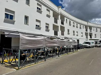 a row of chairs sitting outside of a building at Apartamento Esencia - Ole Solutions in Arcos de la Frontera