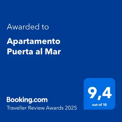 a blue sign with the text awarded to apartment puerta all mar at Apartamento Puerta al Mar in Cádiz