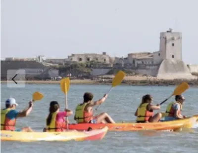 a group of people in kayaks on the water at Cozy Chalet - playa a 200m in Chiclana de la Frontera