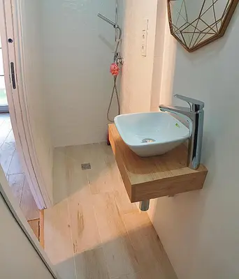 a bathroom with a sink on a wooden counter at Cozy Chalet - playa a 200m in Chiclana de la Frontera