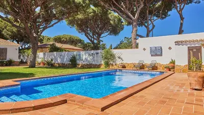 a swimming pool in the backyard of a house at Villa Maymonis Chiclana de la Frontera by Ruralidays in Chiclana de la Frontera