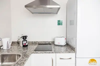 a kitchen with a sink and a counter top at The House of Colors by Cadiz Time in Cádiz