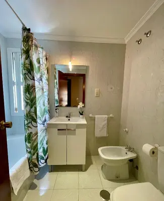 a bathroom with a sink and a toilet and a tub at GATU Villa Palma, aire acc y confort en el centro histórico, 
