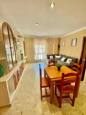 a living room with a table and a couch at GATU Villa Palma, aire acc y confort en el centro histórico, 