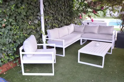 a white couch and two chairs and a table at EL ENCANTO Chiclana in Chiclana de la Frontera