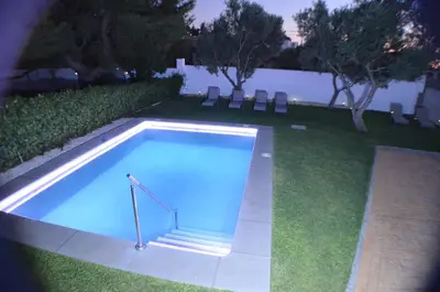 a swimming pool in the middle of a yard at EL ENCANTO Chiclana in Chiclana de la Frontera