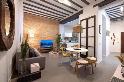 a living room with a couch and a table at Casa Maroca in Cádiz