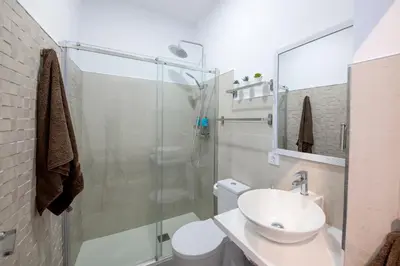 a bathroom with a shower and a sink and a toilet at Casa Maroca in Cádiz