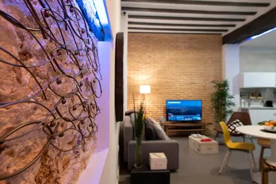 a living room with a couch and a tv at Casa Maroca in Cádiz