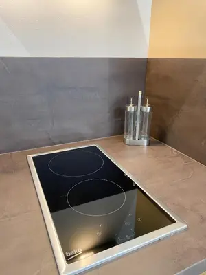 a kitchen counter with a stove top on a counter top at apartamentos la reina in Arcos de la Frontera