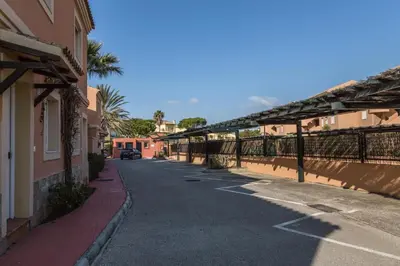 an empty street in a town with buildings at Estupendo Adosado Urbanizacion Hoyo 12 Novo Sancti Petri in Chiclana de la Frontera