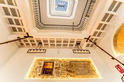 a ceiling view of a room with a window at Fabio Catedral I in Cádiz
