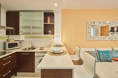 a kitchen with a sink and a counter top at LA MÁS COQUETA, EN EL ADN DE CADIZ, in Cádiz