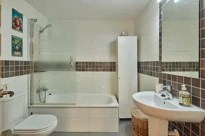 a bathroom with a sink and a tub and a toilet at LA MÁS COQUETA, EN EL ADN DE CADIZ, in Cádiz