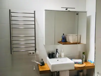 a bathroom with a sink and a mirror at Ático Cádiz Centro in Cádiz