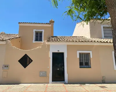 a house with a door in the side of it at NOVO SANCTI PETRI - CASA CON ENCANTO in Novo Sancti Petri