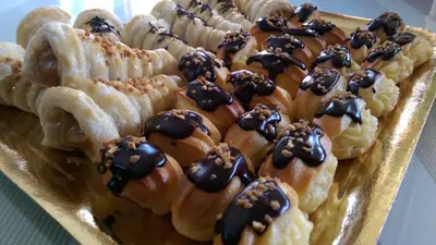 a bunch of waffles with chocolate toppings on them at Hotel Bonilla in La Barca de la Florida