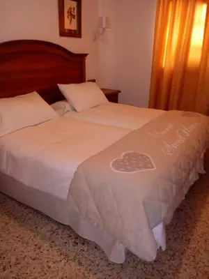 a bedroom with a bed with a heart on it at Hotel Bonilla in La Barca de la Florida
