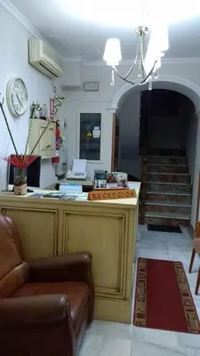 a living room with a counter and a staircase at Hotel Bonilla in La Barca de la Florida