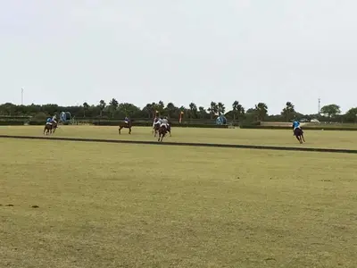 a group of people riding horses on a field at Hotel Bonilla in La Barca de la Florida