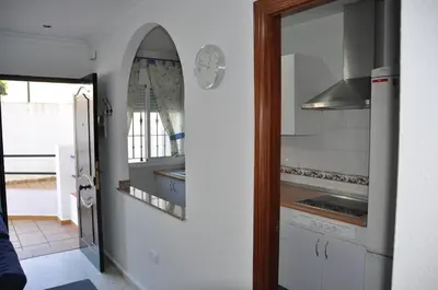 a kitchen with a sink and a stove at Villachipi in Chipiona