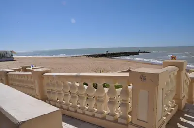 a balcony with a view of the beach at Villachipi in Chipiona