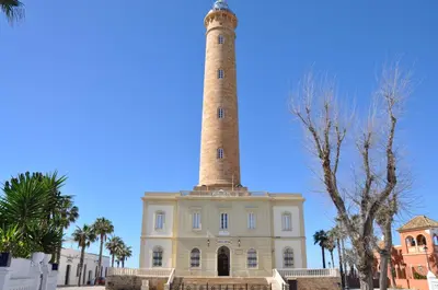 a light house with a lighthouse on top of it at Villachipi in Chipiona