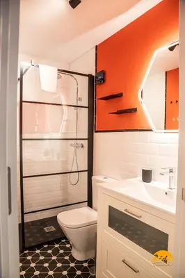 a bathroom with a shower and a toilet and a sink at Casa Arcoiris by Cadiz Time in Cádiz