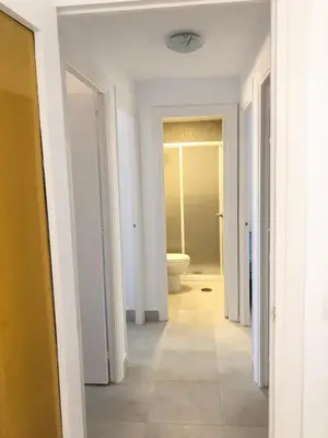 a hallway of a bathroom with a toilet in it at Faro de chipiona in Chipiona