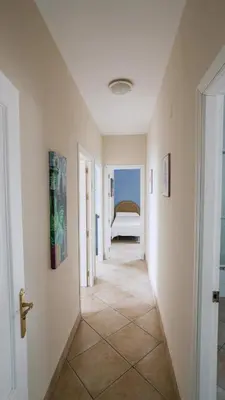 a hallway with a room with a bed in it at Casa Rural Los Garrovillos by Fontanilla del Mar Holidays Rentals in Conil de la Frontera