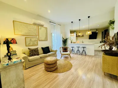 a living room with a couch and a table at MANA home Keep calm feel the light and shine in Cádiz