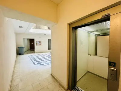 an empty hallway with an open door in a building at MANA home Keep calm feel the light and shine in Cádiz