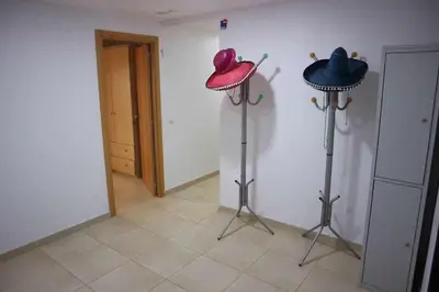 a room with two hats on a wall at La Casona de Rances Grupo AC Gestion in Cádiz
