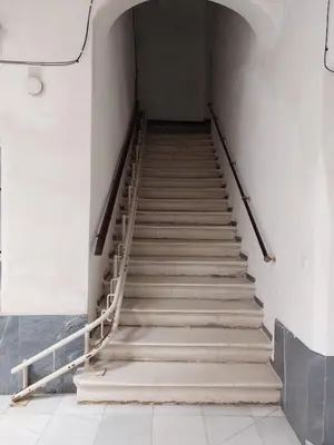 a stairway in a building with a bunch of stairs at La Casona de Rances Grupo AC Gestion in Cádiz