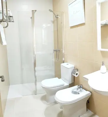 a bathroom with a shower and a toilet and a sink at RELAX CHICLANA-Aparcamiento privado-TV Cable-WifiPlus-Aire Acond-Incluido in Chiclana de la Frontera