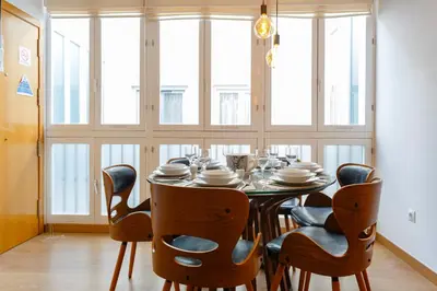 a dining room with a table and chairs at Atico & Jacuzzi CRUZ by Cadiz4Rentals in Cádiz