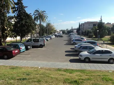 a row of cars parked in a parking lot at APARTAMENTO CENTRO JARDINES TEMPUL in Jerez de la Frontera