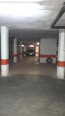 a parking garage with a car parked in it at APARTAMENTO CENTRO JARDINES TEMPUL in Jerez de la Frontera