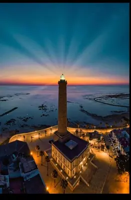 an aerial view of a lighthouse at night at Casa mirando al mar, hermosas vistas. in Chipiona