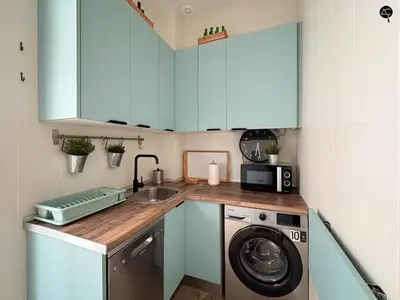 a kitchen with a washing machine and a sink at Cadiz Cinema Grupo AC Gestion in Cádiz