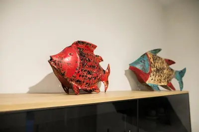 two fish vases sitting on top of a shelf at innCádizCASA SEÑORIAL DE 1790 in Cádiz