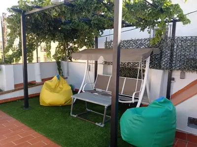 a gazebo with a chair and a table at Kiana Loft, La Casa del Parral in Jerez de la Frontera
