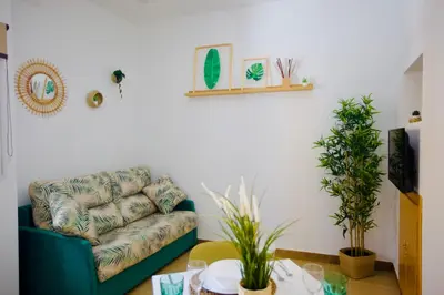 a living room with a couch and a table at Loft CENTRO San Diego in Sanlúcar de Barrameda