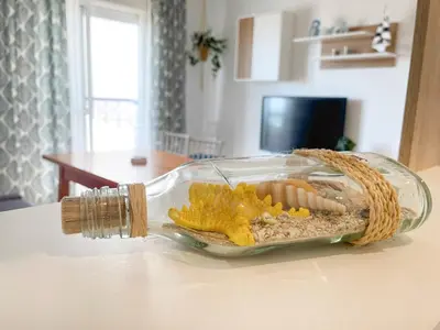 a glass container of food on a table at Azvalia - Valparaíso beach apartment - Piscina y parking gratis in El Puerto de Santa María