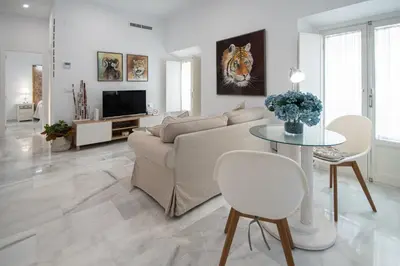 a living room with a couch and a table at Apartamento Animalia in Cádiz