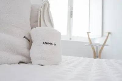 a pair of socks with the word amazon on a bed at Apartamento Animalia in Cádiz