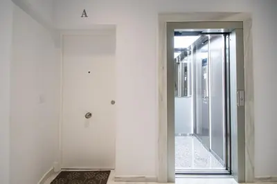 a hallway with a glass door leading into a room at Apartamento Animalia in Cádiz