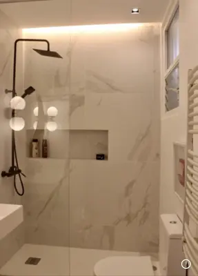 a bathroom with a shower with a glass door at PLAZA CABILDO 4 in Sanlúcar de Barrameda
